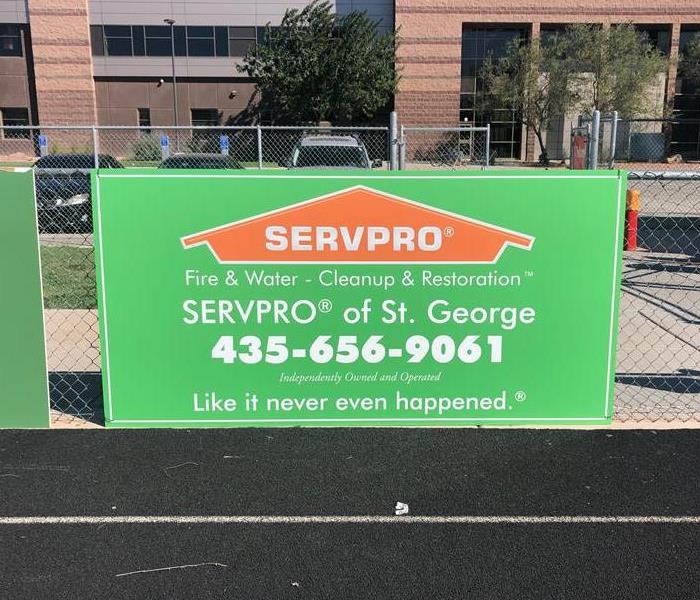 a green sign that says SERVPRO of St George
