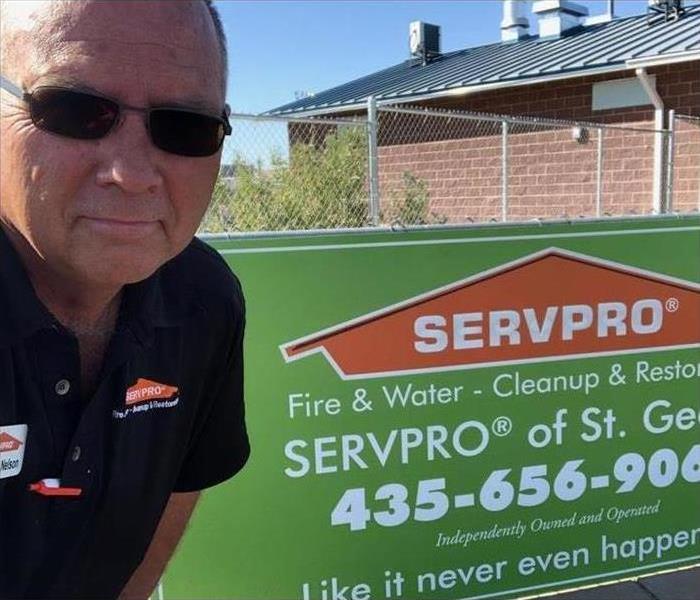 SERVPRO worker took a picture with a new SERVPRO sign